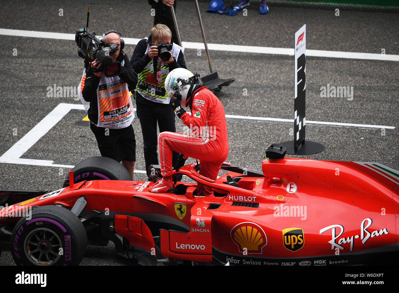 German F1 Sebastian Vettel of Ferrari reacts after winning the pole ...