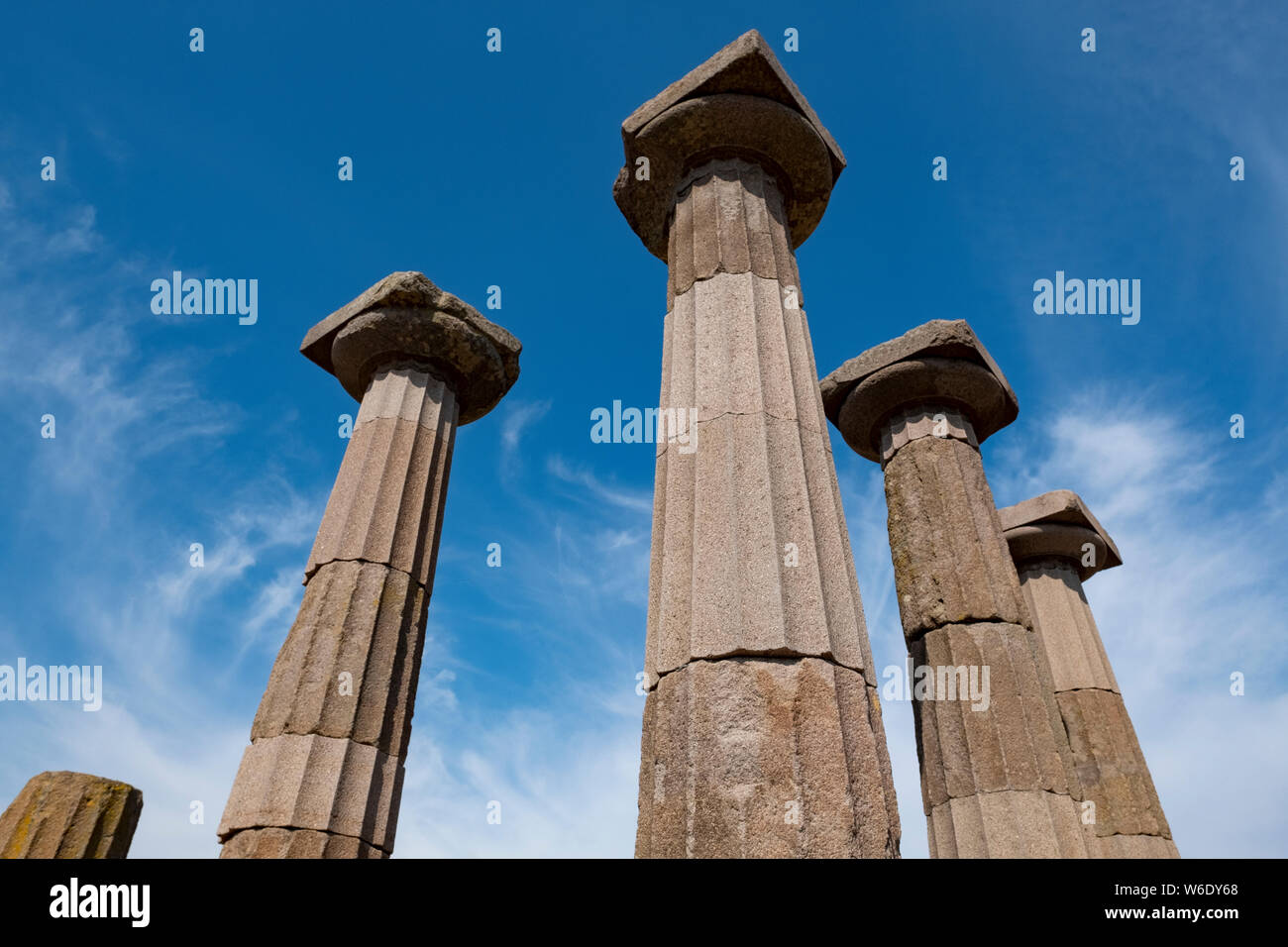 The remaining Doric columns of the ancient Greek Temple of Athena on a hill overlooking the Aegean Sea in present day Behramkale, Turkey Stock Photo
