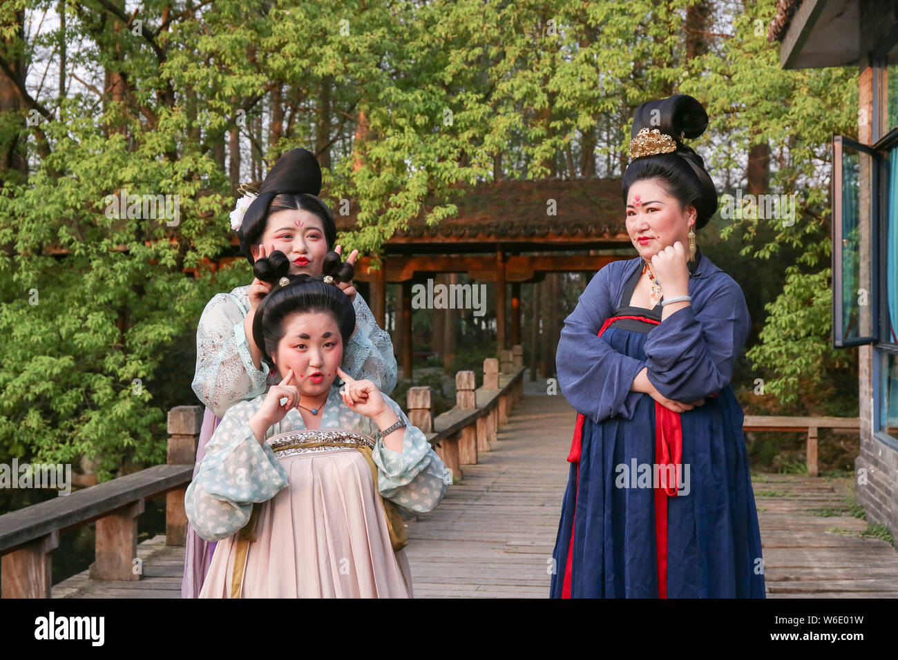 Chinese women dressed in Han Chinese clothing that imitates the style of clothes worn by women during the Tang Dynasty (618-907) pose for a photo at t Stock Photo