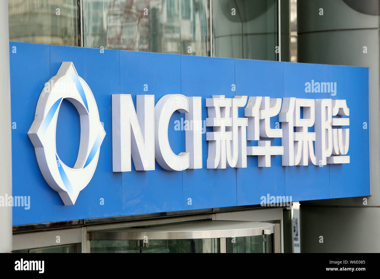 --FILE--A signboard of NCI (New China Life Insurance) is seen in Shanghai, China, 3 February 2015.   New China Life Insurance's net profit surged 42% Stock Photo