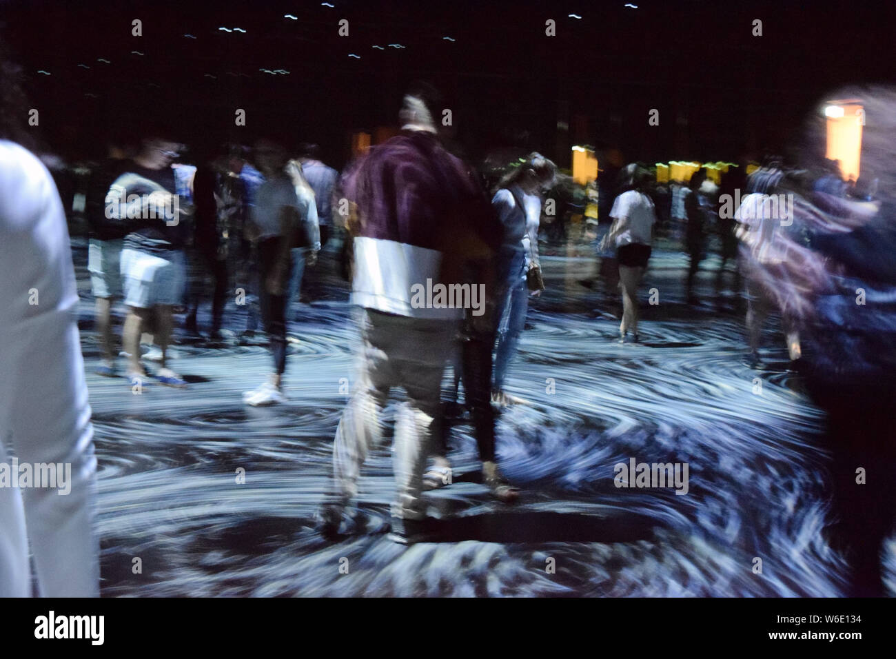 View of 'Step Inside a Swirling Mirror Room of Interactive Ocean Vortices' by teamLab on display during the NGV Triennial art exhibition at the Nation Stock Photo