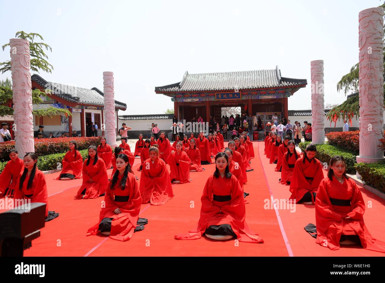 Chinese girls dressed in traditional Han costumes take part in a ...