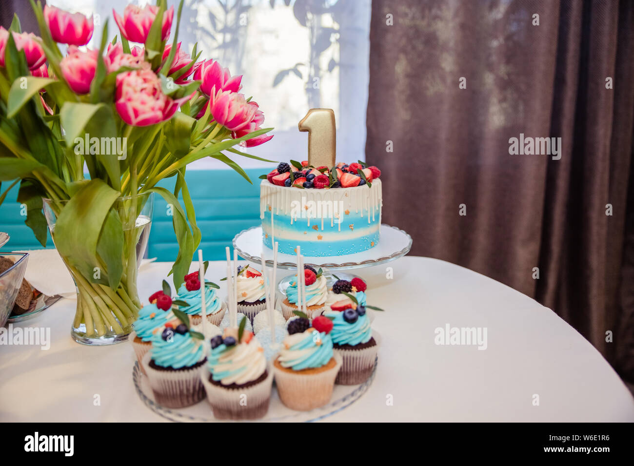 Candy Bar Decorated With Sweets Cupcakes And Cake For 1st Birthday Party Interior Decoration For A Kids Child Birthday Is One Year In Blue And Ultra Stock Photo Alamy