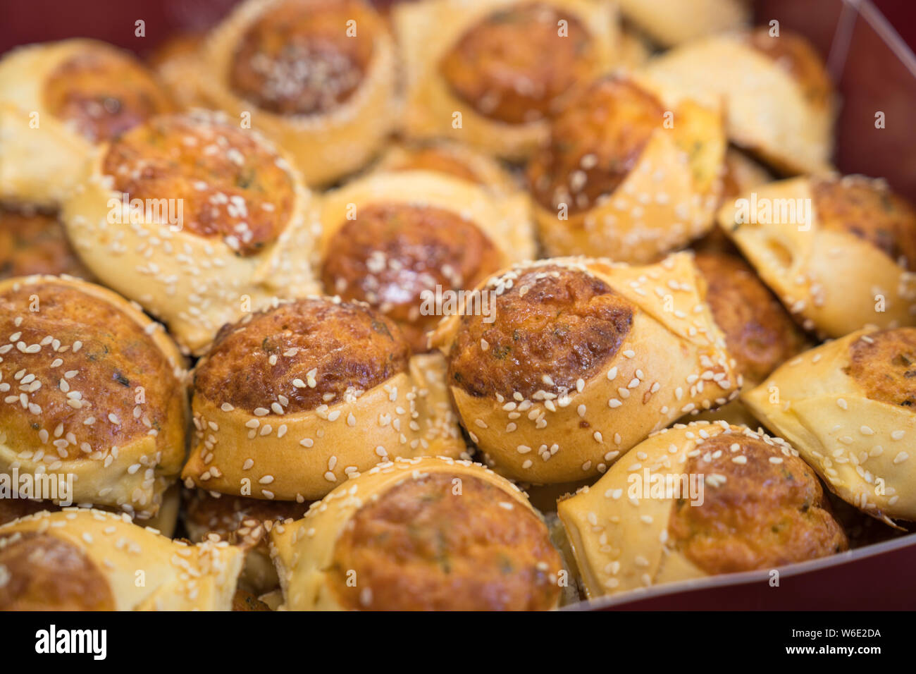 Flaounes are savoury Easter pastries that contain goats cheese (or a variety of cheeses), eggs, spices and herbs all wrapped in a yeast pastry. Stock Photo