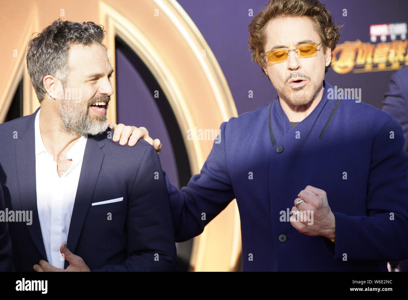 (From left) American actor and singer Robert Downey Jr. and English actor Tom Hiddleston pose as they arrive on the red carpet of a promotional event Stock Photo