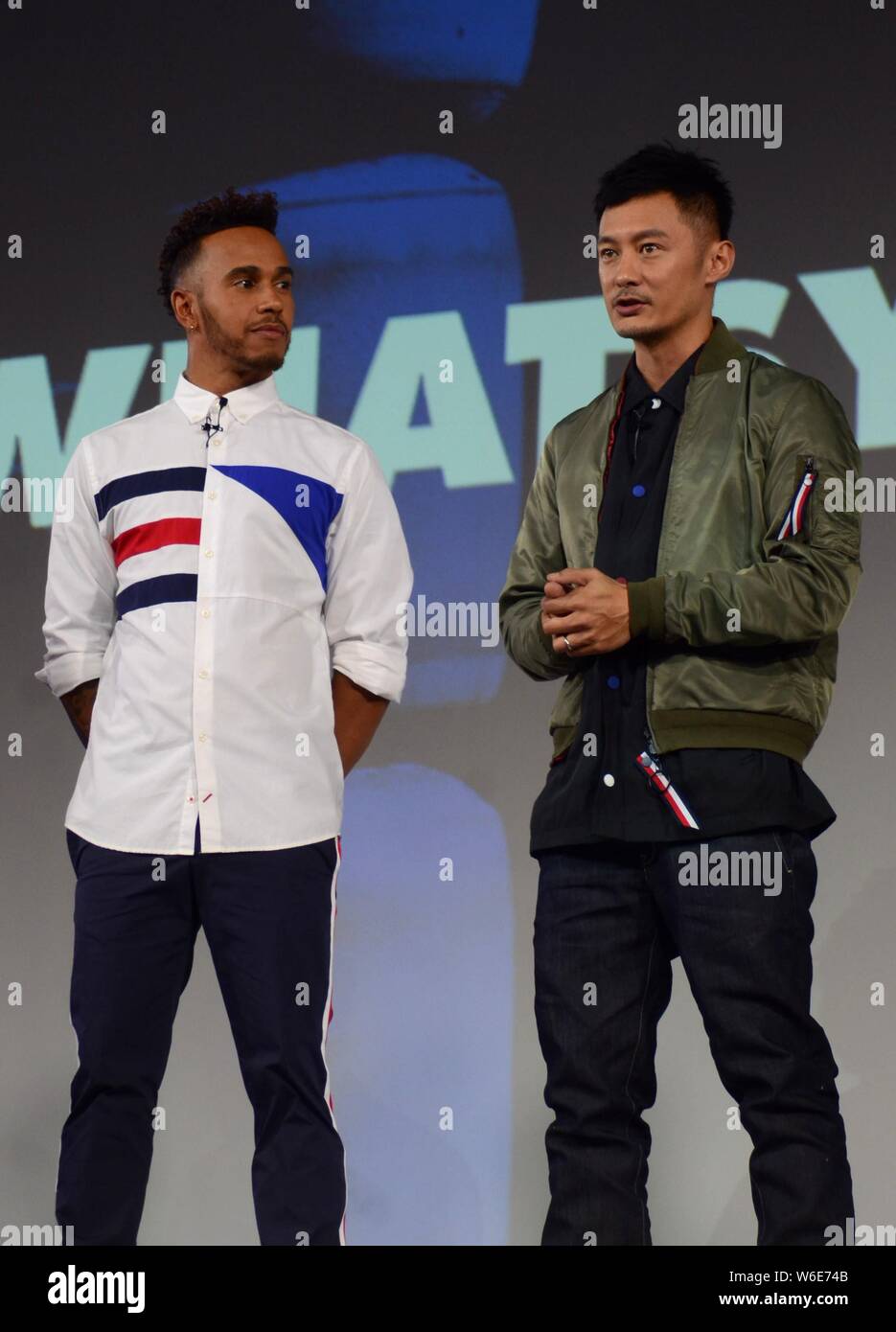 Mercedes' British F1 driver Lewis Hamilton, left, Hong Kong singer and  actor Shawn Yue, attend a promotional event by fashion brand Tommy Hilfiger  in Stock Photo - Alamy