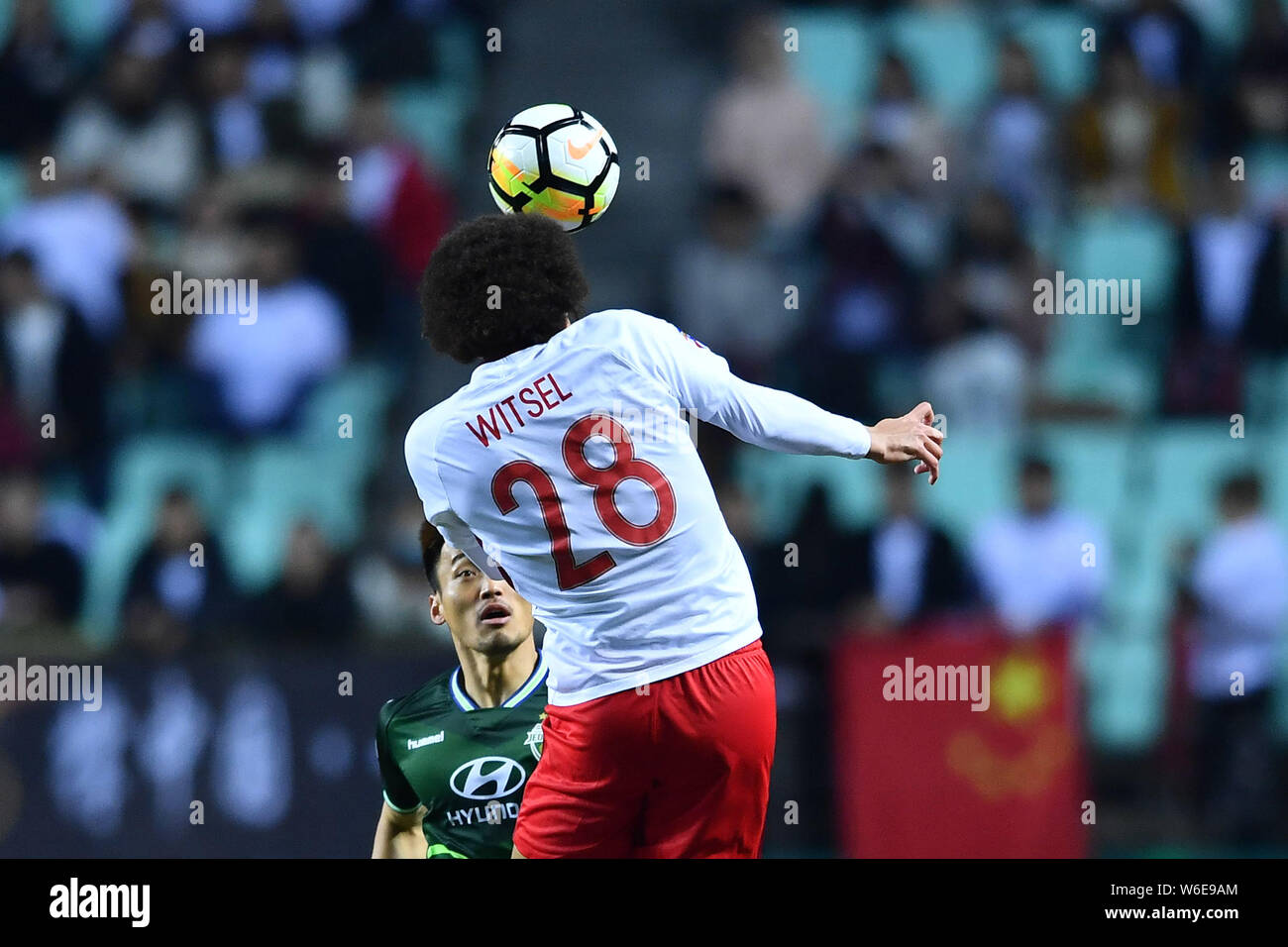 Belgian football player Axel Witsel of China's Tianjin Quanjian heads the ball against South Korea's Jeonbuk Hyundai Motors in a Group E match during Stock Photo