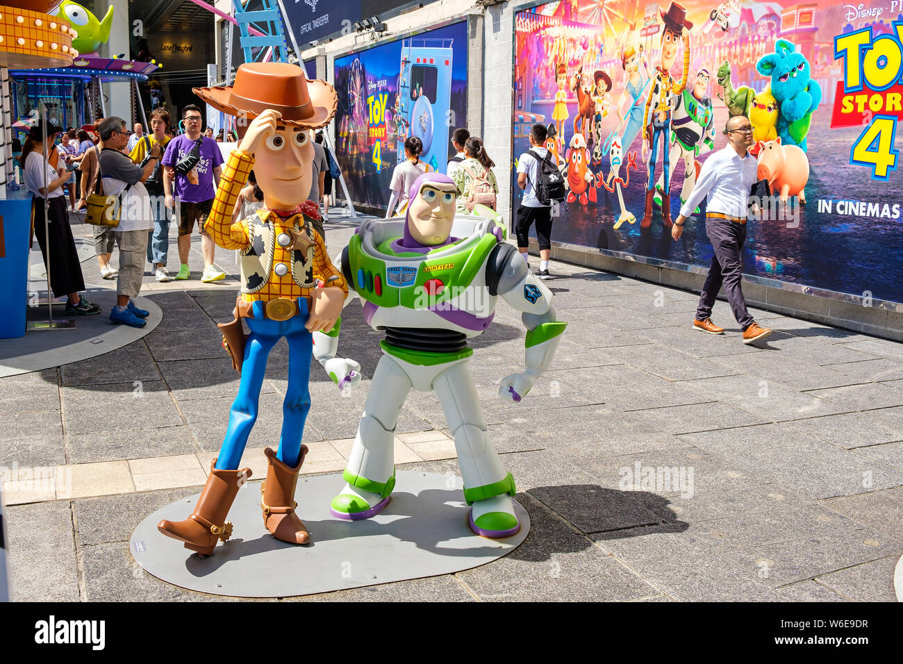 Replicas of Sheriff Woody and Buzz Lightyear seen during the Carnival.Toy Story 4 is celebrated with a themed carnival of different games and challenges at Hong Kong Harbour City. Stock Photo