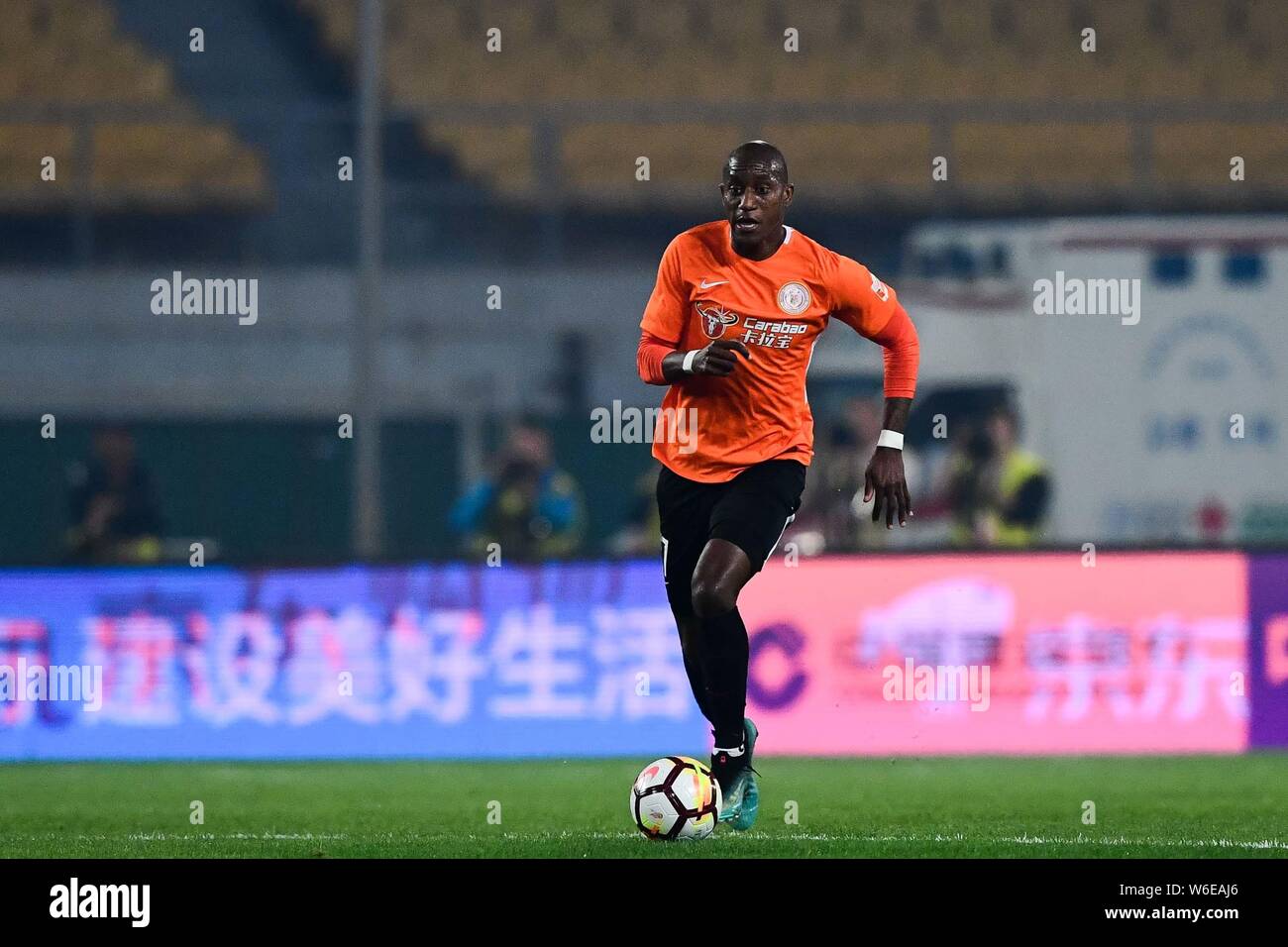 Ecuadorian football player Jaime Ayovi of Beijing Renhe dribbles the ball against Beijing Sinobo Guoan in their fourth round match during the 2018 Chi Stock Photo