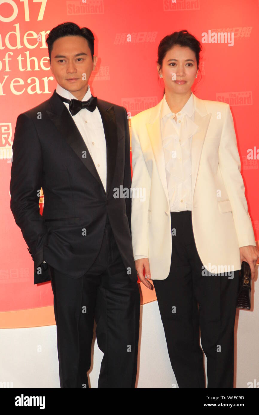 Hong Kong Actor Julian Cheung Left And His Actress Wife Anita Yuen Poses As They Arrive At The 0237