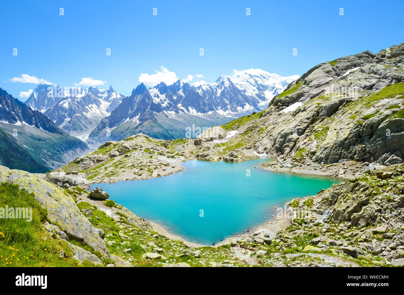 Beautiful landscape of French Alps. Turquoise Lake Blanc, in French Lac Blanc photographed on a sunny summer day with Mont Blanc and other high Alpine mountains in background. Amazing nature, France. Stock Photo