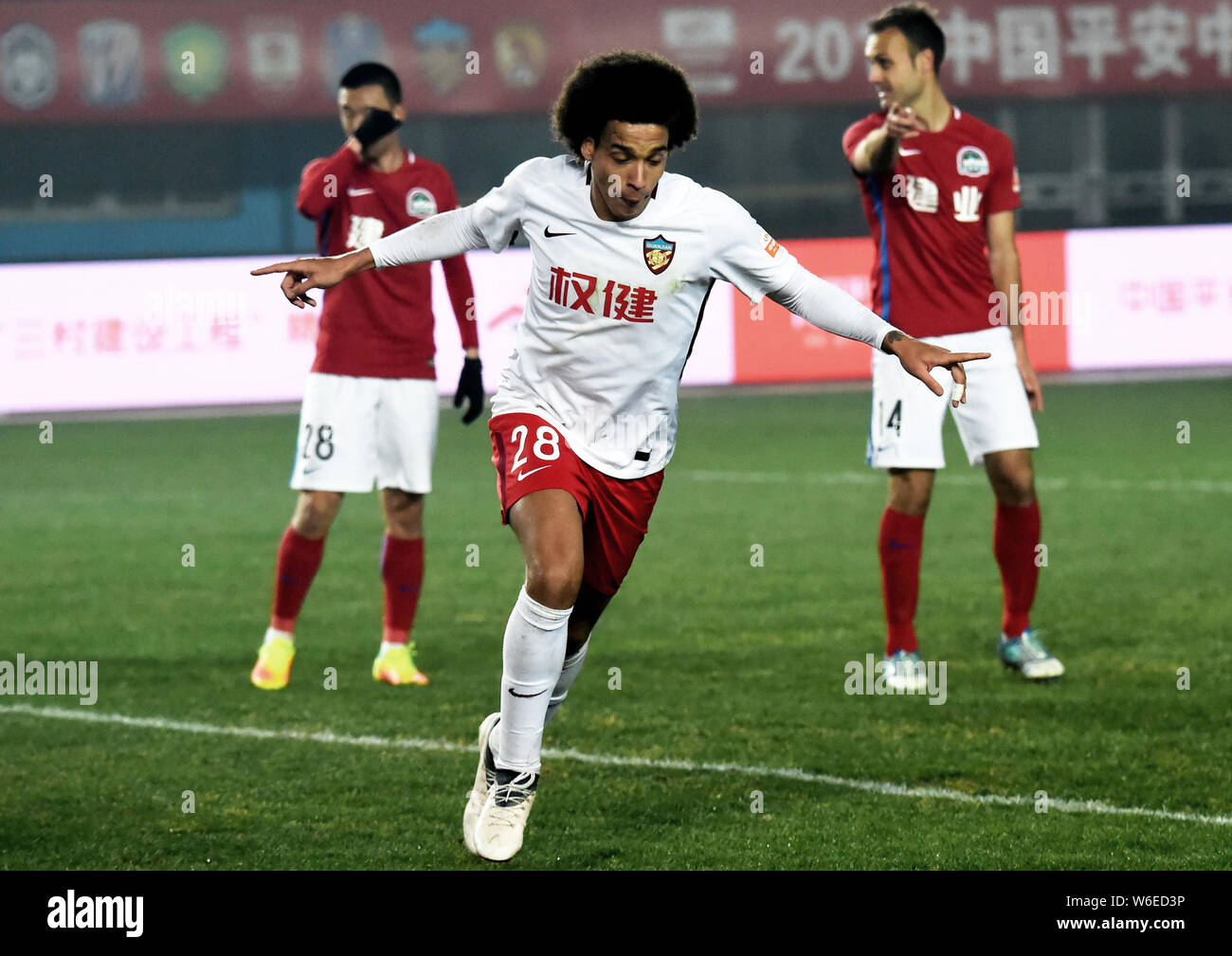 Belgian football player Axel Witsel of Tianjin Quanjian celebrates after scoring a goal against Henan Jianye in their 1st round match during the 2018 Stock Photo
