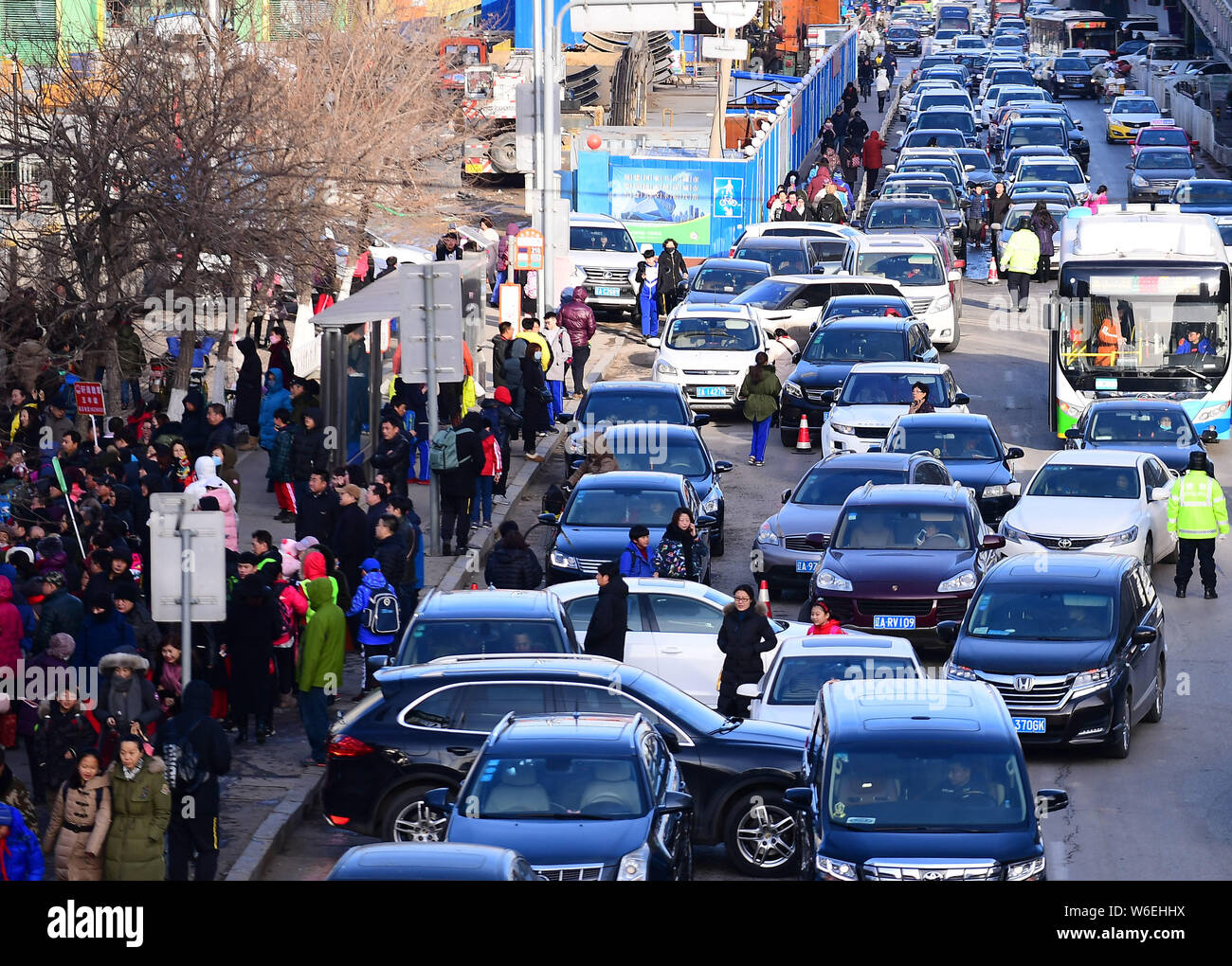 Chinese parents pick up their children from school hi-res stock ...