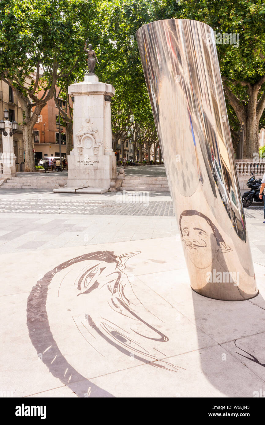 Artwork of the artist Salvador Dali; a reflection of a self portrait on the sidewalk in Figueres, Girona, Catalonia, Spain, Europe. Stock Photo