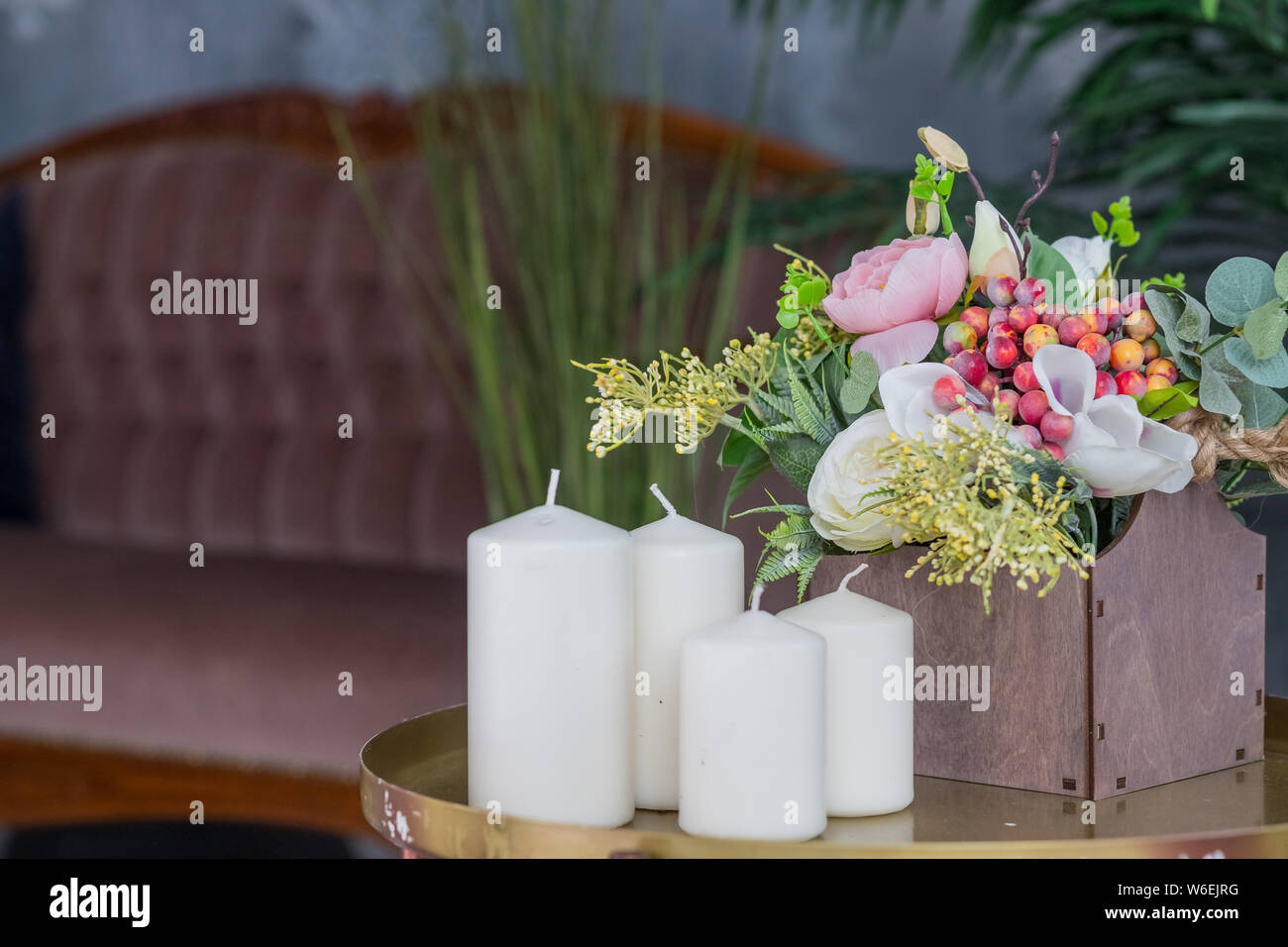 Organic candle and wooden box with flowers on small table. Loft interior  decor, minimalism concept. Shabby old interior decor for farmhouse.white  Stock Photo - Alamy