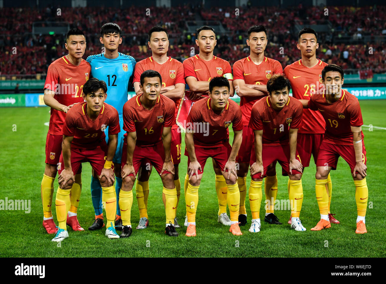 Players of the starting line-up of Chinese national men's football team  pose before competing against Wales national football team in the  semi-final m Stock Photo - Alamy