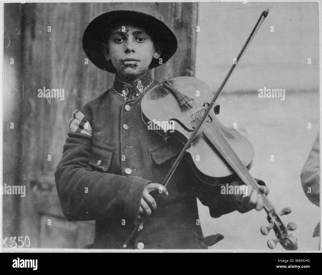 English: A Christmas street fiddler, Belgrade. Serbia [Yugoslavia], December 1918. American Red Cross, 1917–19; General notes:  Use War and Conflict Number 676 when ordering a reproduction or requesting information about this image. Stock Photo