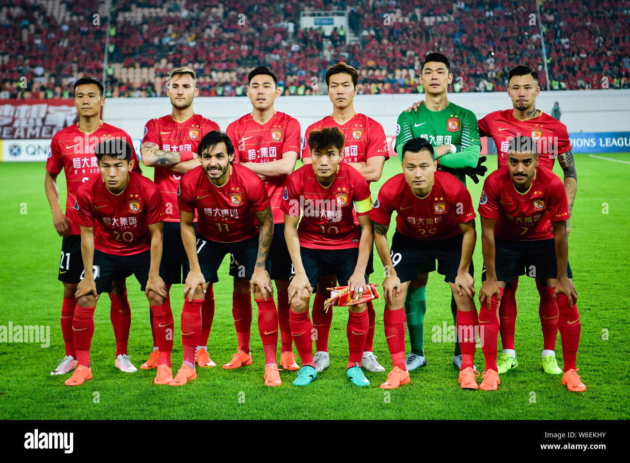 Players of the starting line up of China s Guangzhou Evergrande