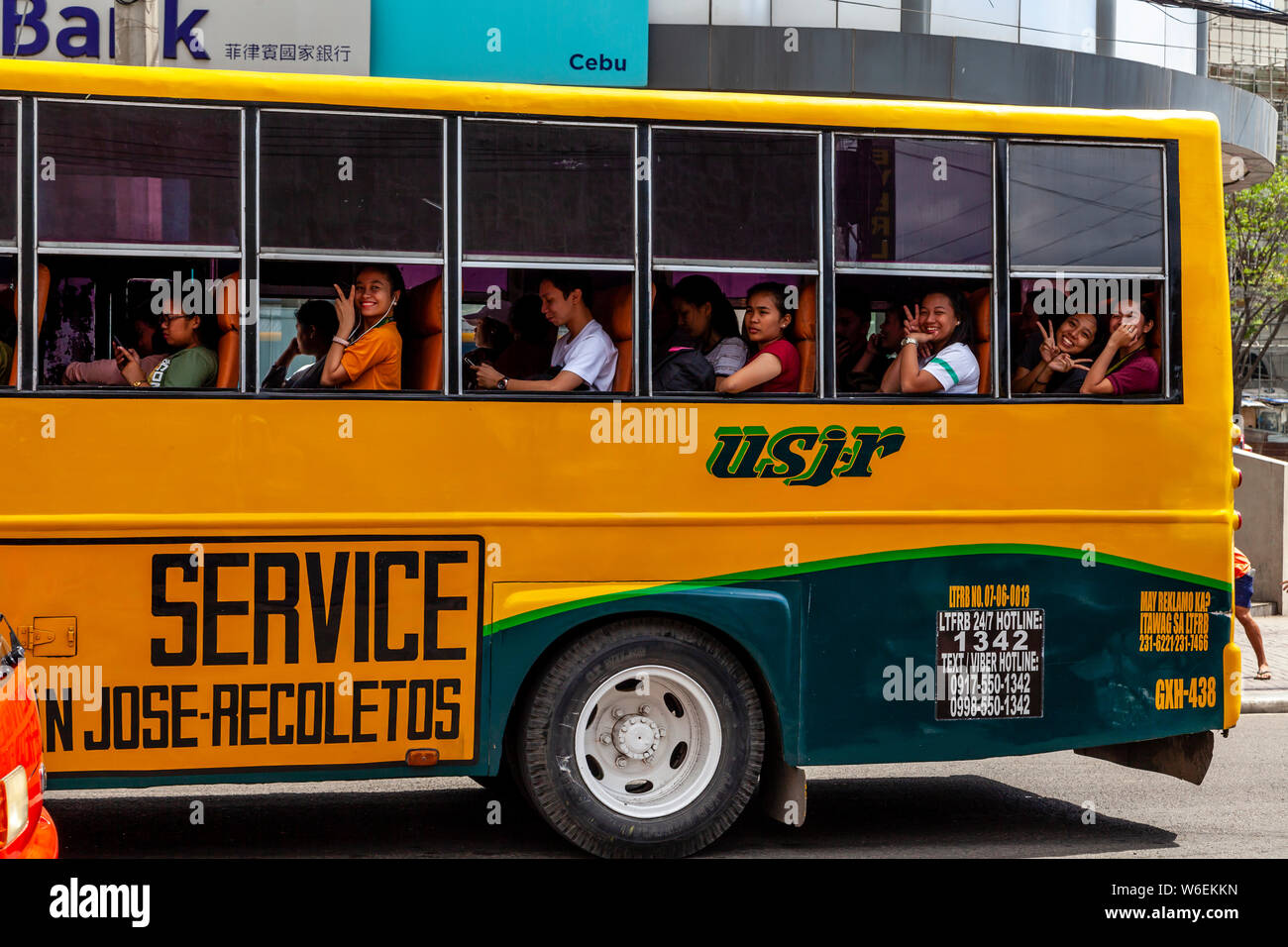 Young Filipinos On A Bus, Cebu City, Cebu, The Philippines Stock Photo