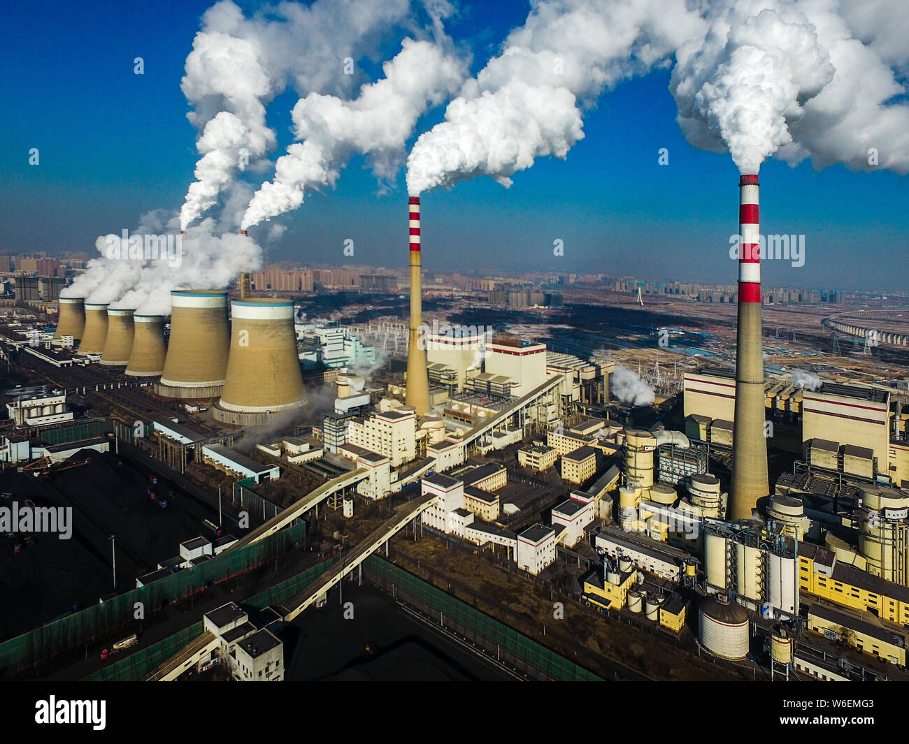 Smoke is discharged from chimneys at a coal-fired power plant of China  Guodian Corporation in Datong city, north China's Shanxi province, 17 March  201 Stock Photo - Alamy