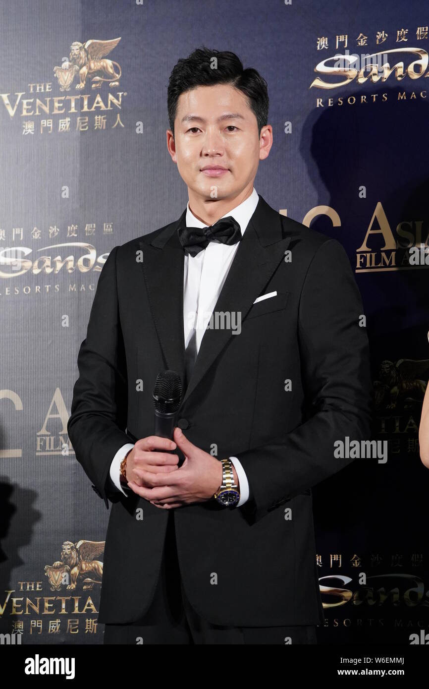 South Korean actor Lee Jung-jin poses as he arrives on the red carpet for the 12th Asian Film Awards in Macau, China, 17 March 2018. Stock Photo