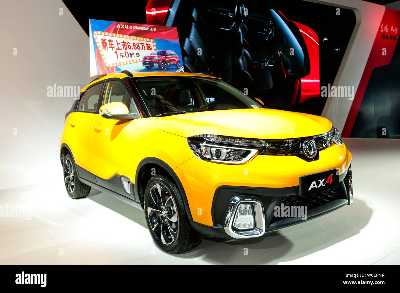 --FILE--A Dongfeng AX4 car is on display during a car exhibition in Chongqing, China, 25 November 2017.   French carmaker Groupe PSA is setting up a j Stock Photo