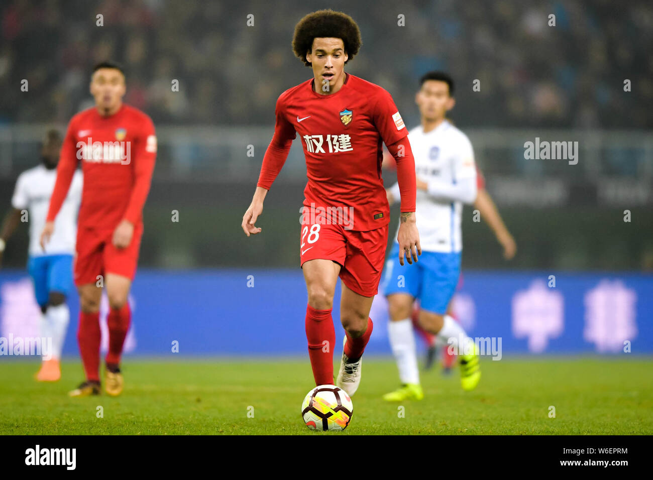 Belgian football player Axel Witsel of Tianjin Quanjian dribbles against Tianjin TEDA in their third round match during the 2018 Chinese Football Asso Stock Photo