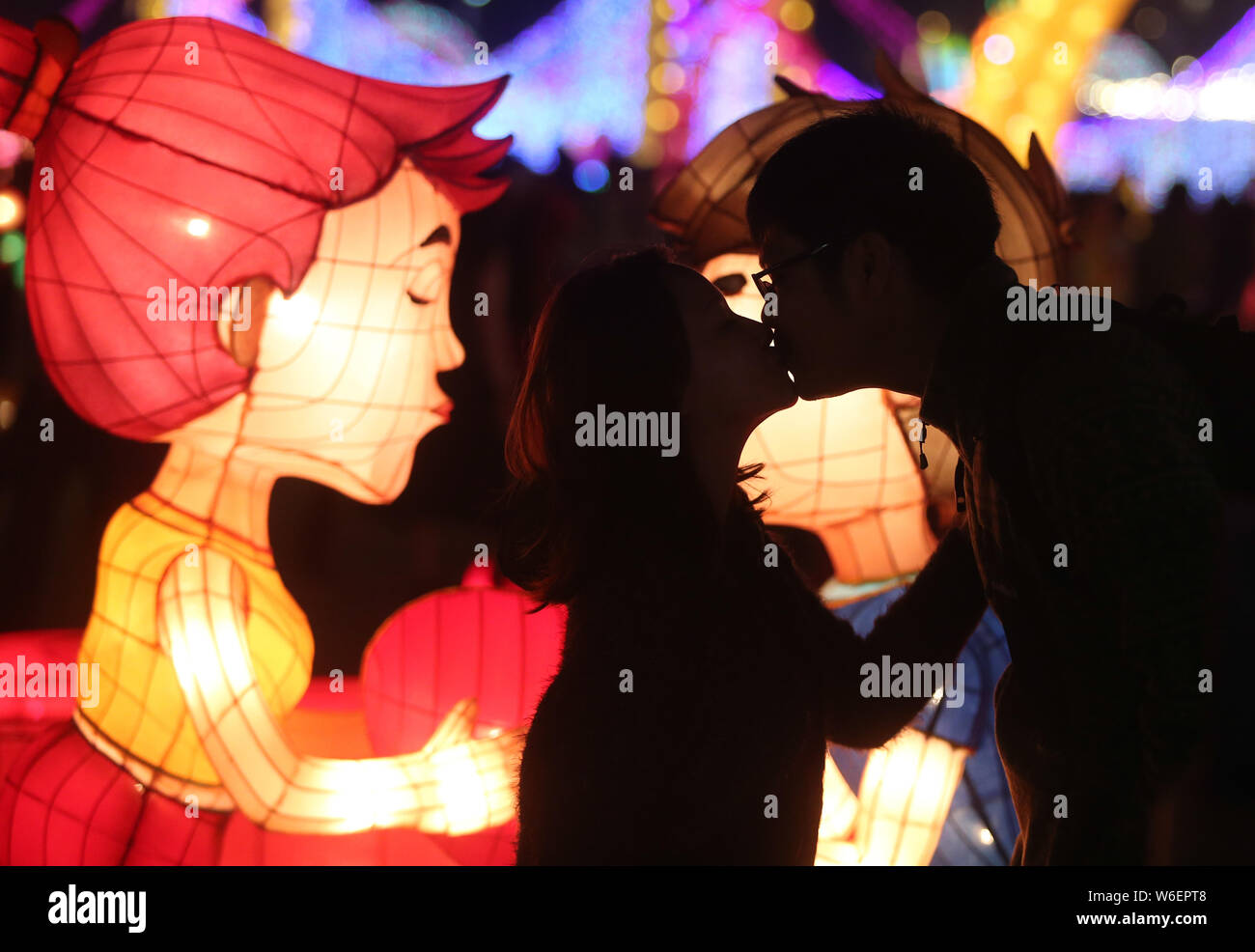 **TAIWAN OUT**A couple kisses in front of illuminated lanterns during the annual Pingxi Sky Lantern Festival in Pingxi district, New Taipei, Taiwan, 2 Stock Photo