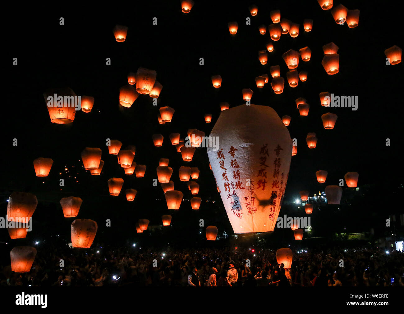 **TAIWAN OUT**Taiwanese and foreign tourists release lanterns into the sky in hopes of good fortune and prosperity during the annual Pingxi Sky Lanter Stock Photo