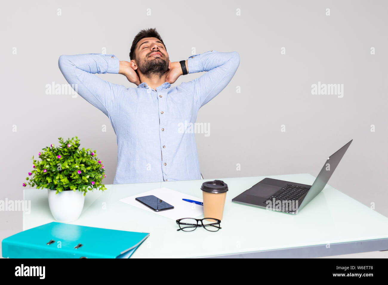 Happy successful businessman stretching hi-res stock photography and ...