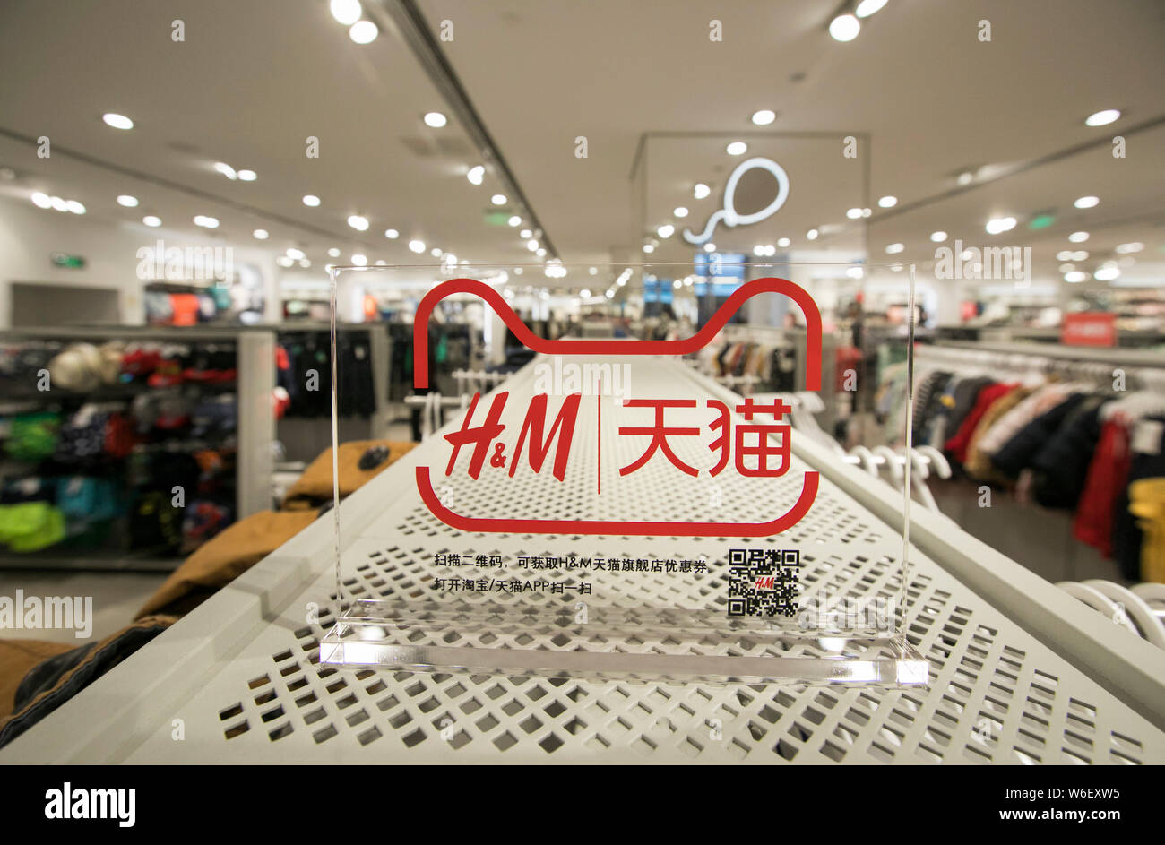 A logo of fashion retailer H&M and the online shopping site Tmall.com of  Chinese e-commerce giant Alibaba Group is pictured at an H&M store in  Shangha Stock Photo - Alamy