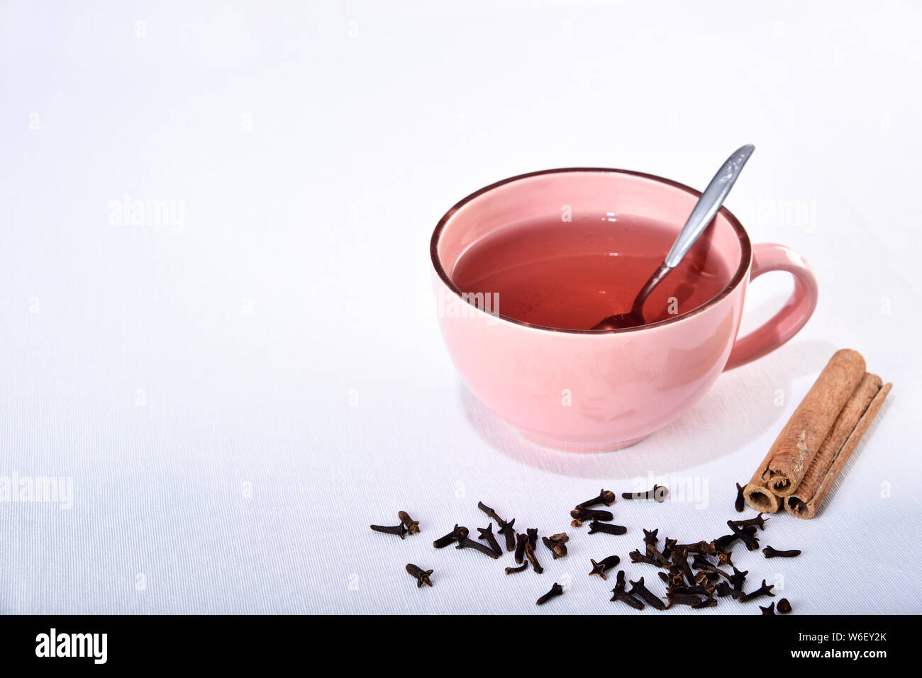 natural cinnamon tea and clove on white background Stock Photo Alamy