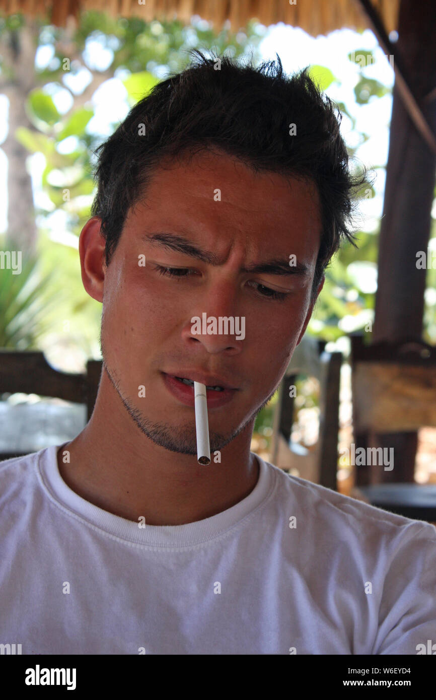 Unlit cigarette in mouth hi-res stock photography and images