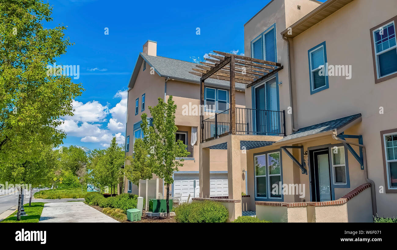 Panorama frame Concrete pathway in front of houses with balconies and ...
