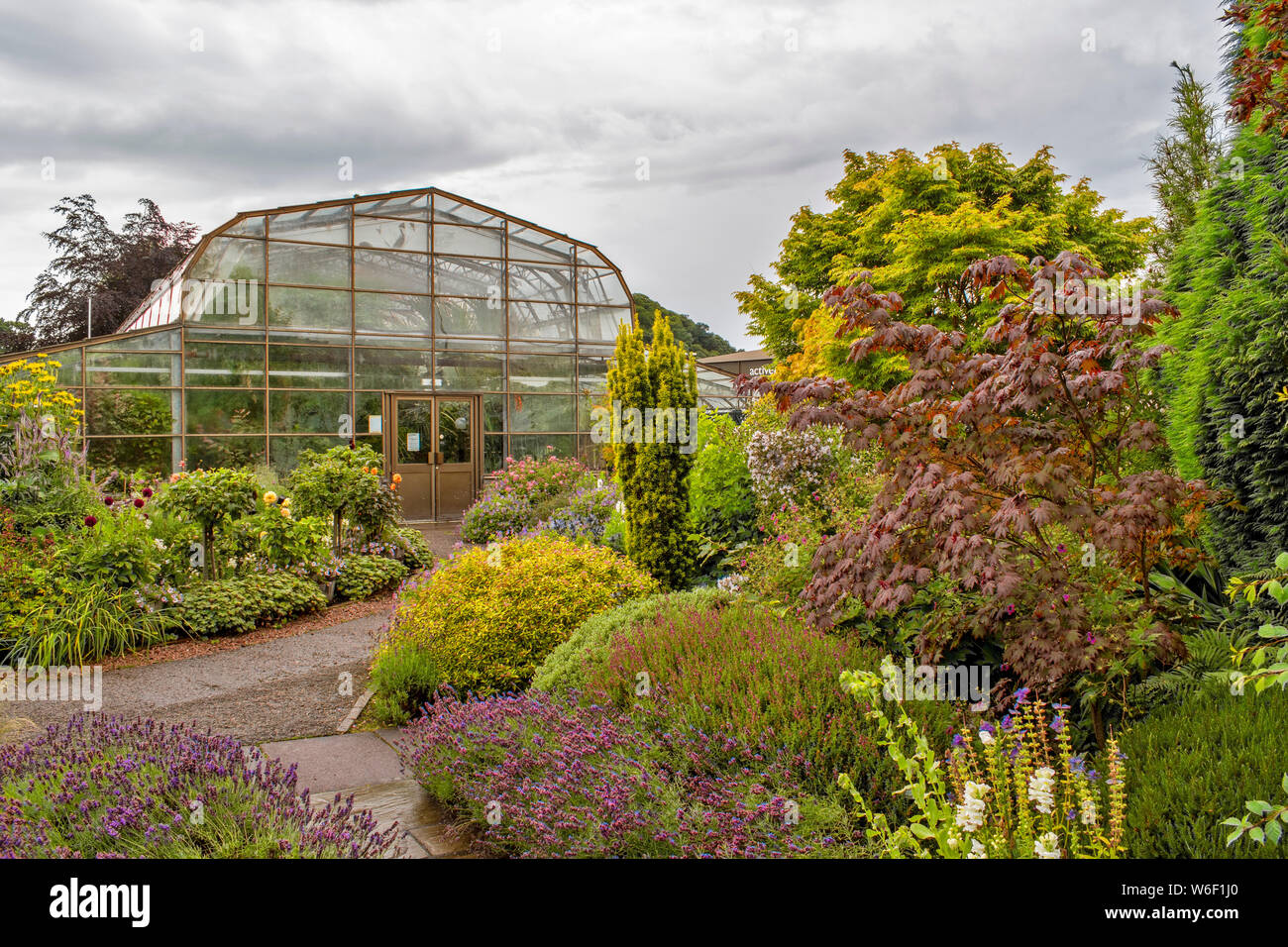INVERNESS SCOTLAND THE BOTANIC GARDENS GREENHOUSE SURROUNDED BY TREES