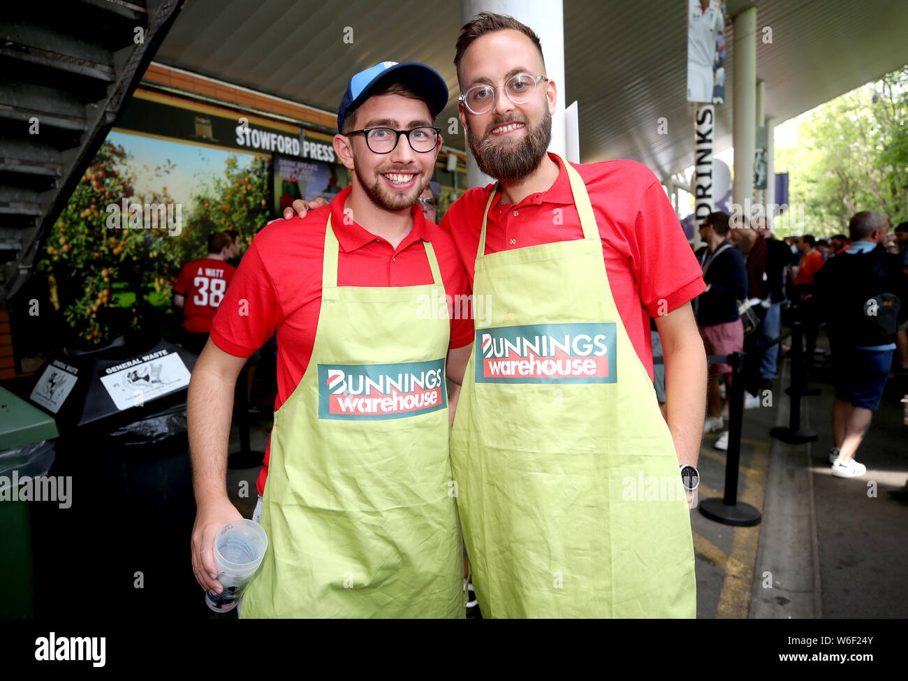 Fans pose for a photo in Bunnings Warehouse uniforms during day one of