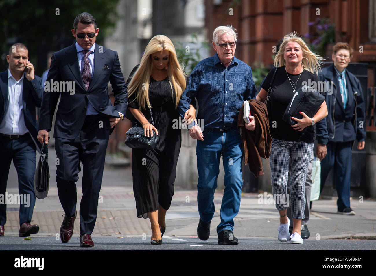 John 'Kenny' Collins (second right), ringleader of the Hatton Garden heist, arrives at Westminster Magistrates' Court, London, where he is set to hear if he will be sent back to jail for failing to pay back millions of pounds stolen in the raid. Stock Photo