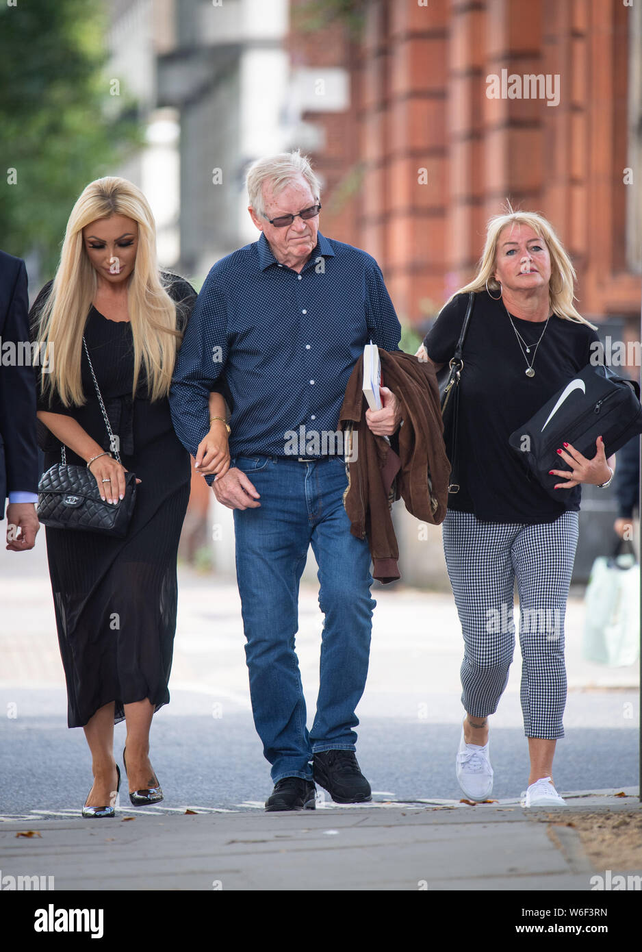 John 'Kenny' Collins (centre), ringleader of the Hatton Garden heist, arrives at Westminster Magistrates' Court, London, where he is set to hear if he will be sent back to jail for failing to pay back millions of pounds stolen in the raid. Stock Photo