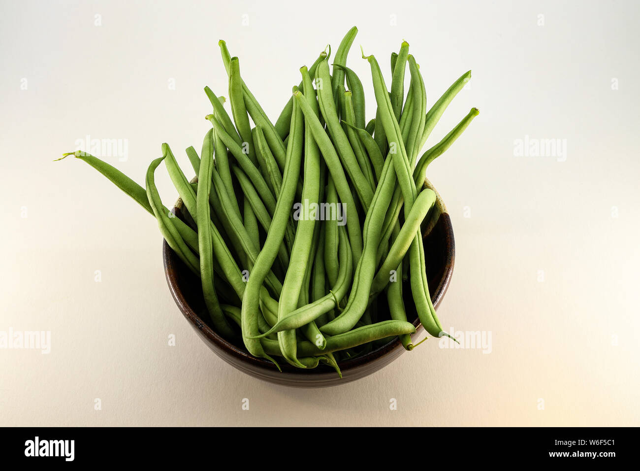 Bowl of fresh Green Beans - white back ground Stock Photo