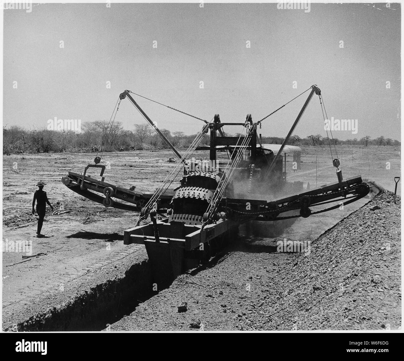Africa. French West Africa. This U.S.-made Buckeye ditcher is one of Economic Cooperation Administration's greatest contributions to the Niger project. In a single day one of these $50,000 machines can dig an irrigation canal one mile long and three feet deep. The ditcher shown here working in the new N'Debougou rice fields is handled by a six-man crew of natives Stock Photo