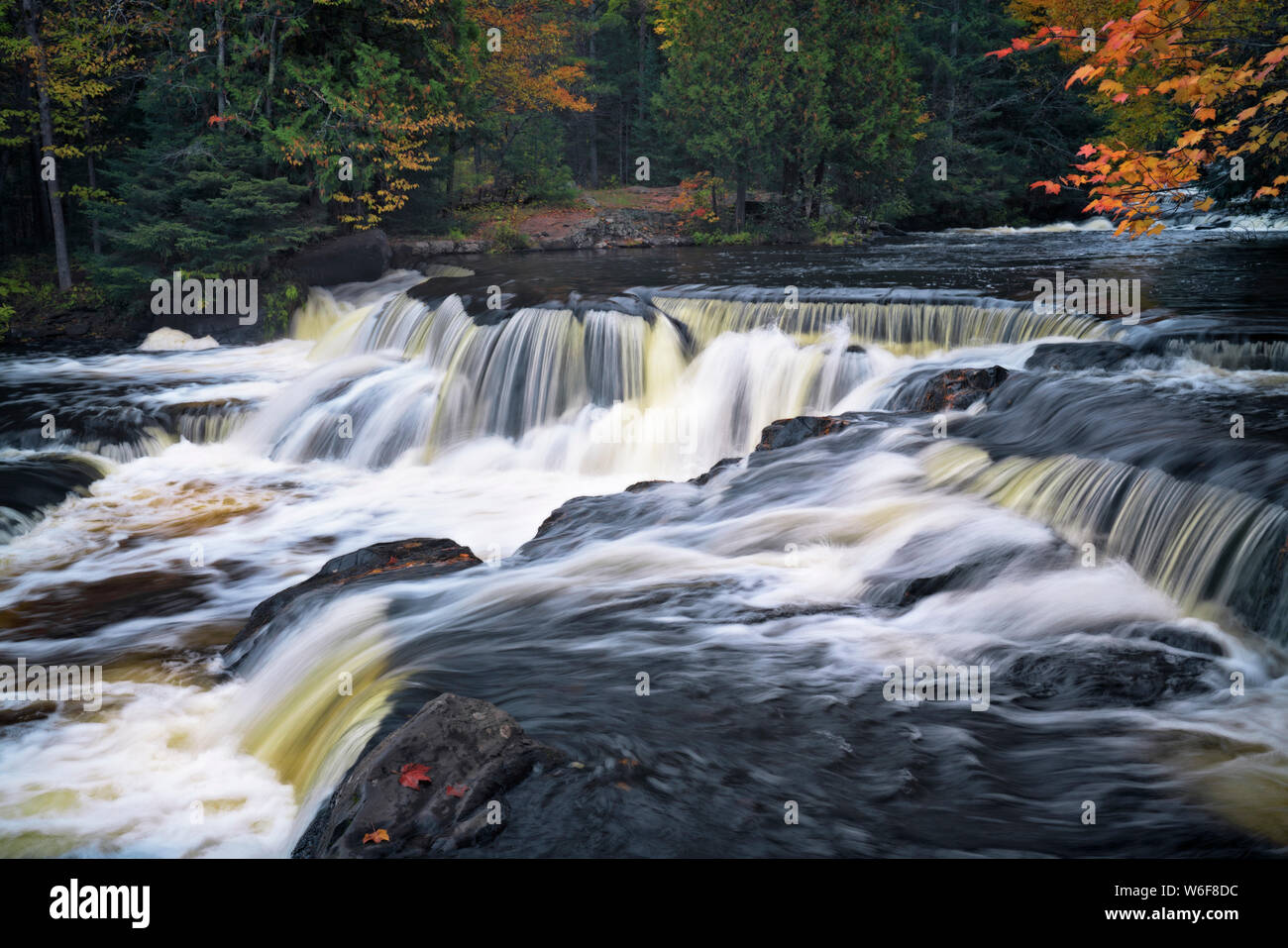 Morning fog lifts revealing the autumn reflection of the Hiawatha
