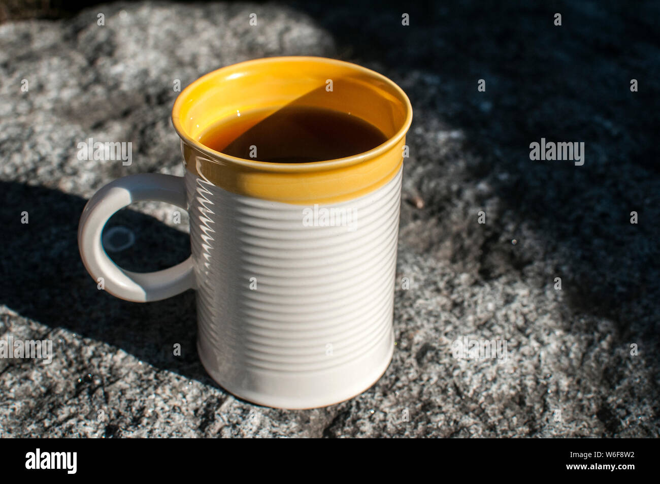 Ceramic tea mug closeup on stone surface closeup Stock Photo
