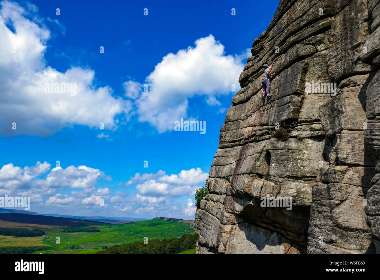 Rock climbers on Stanage Edge, Gritstone, Peak District, National Park