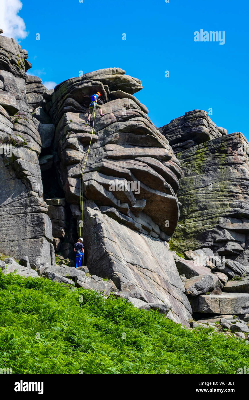Stanage Edge Rocks Rock climbers on Stanage Edge, Gritstone, Peak District, National Park ...