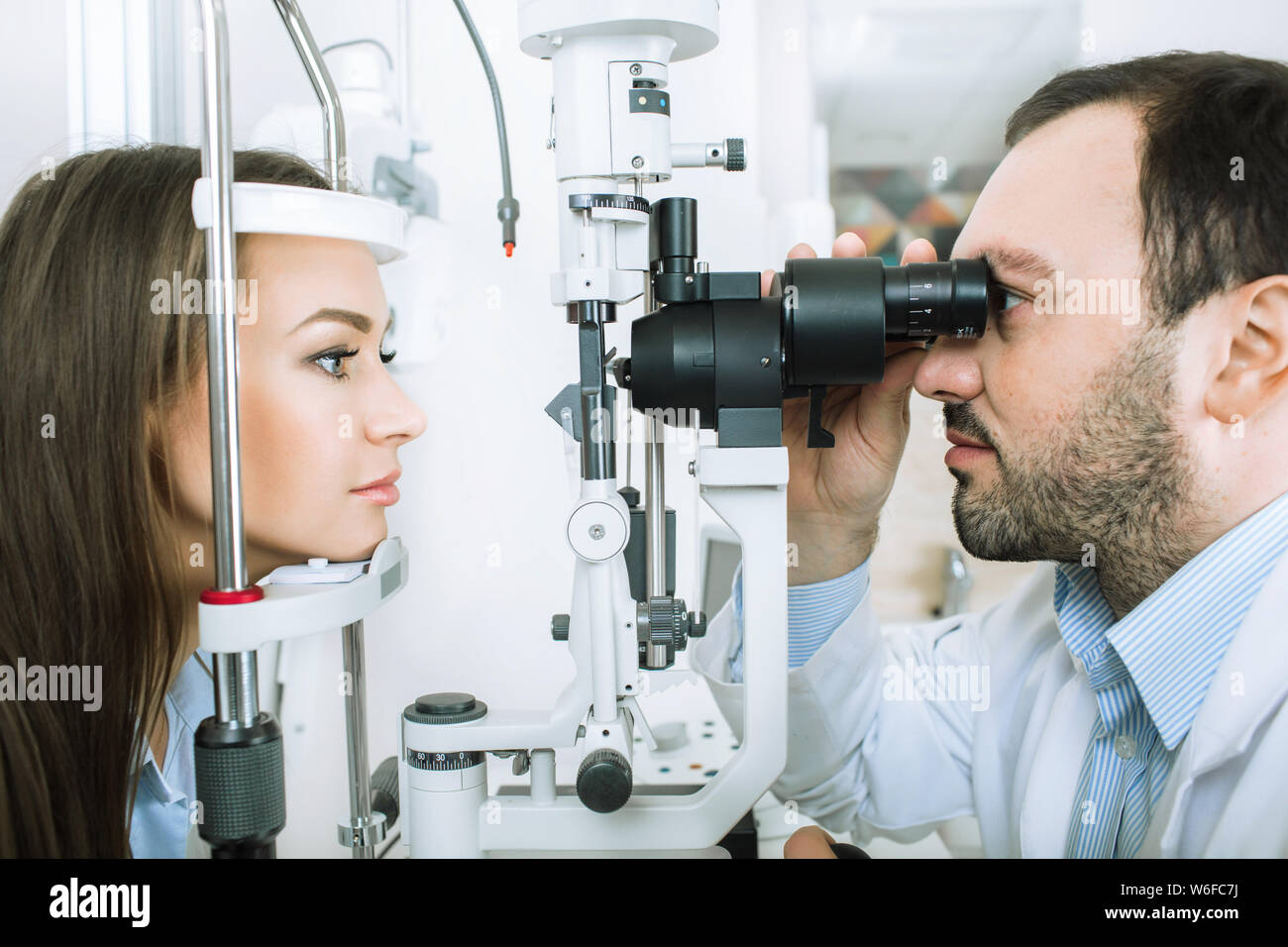 Ophthalmologist examining female patient Stock Photo