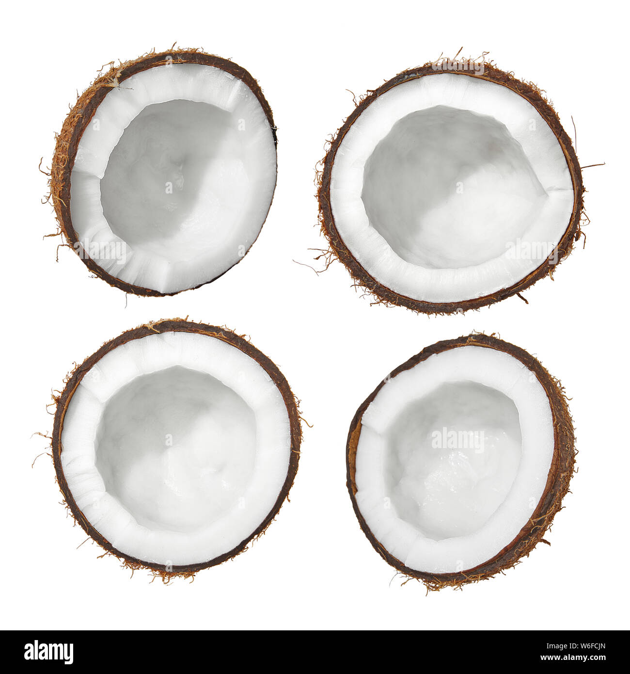 4 coconut halves isolated on white background, half coconuts flat lay Stock Photo