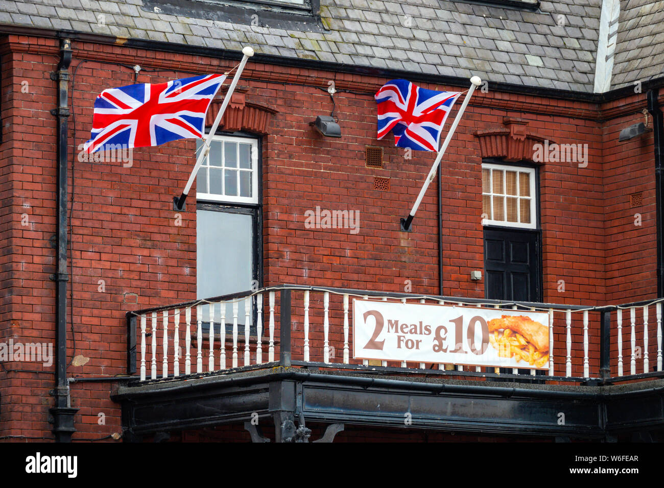 English pub with union Jack flags, August, Saltburn by the Sea, North