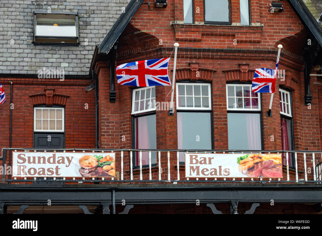 English pub with union Jack flags, August, Saltburn by the Sea, North