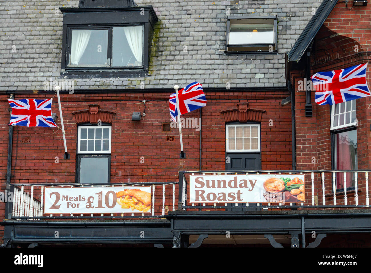 English pub with union Jack flags, August, Saltburn by the Sea, North