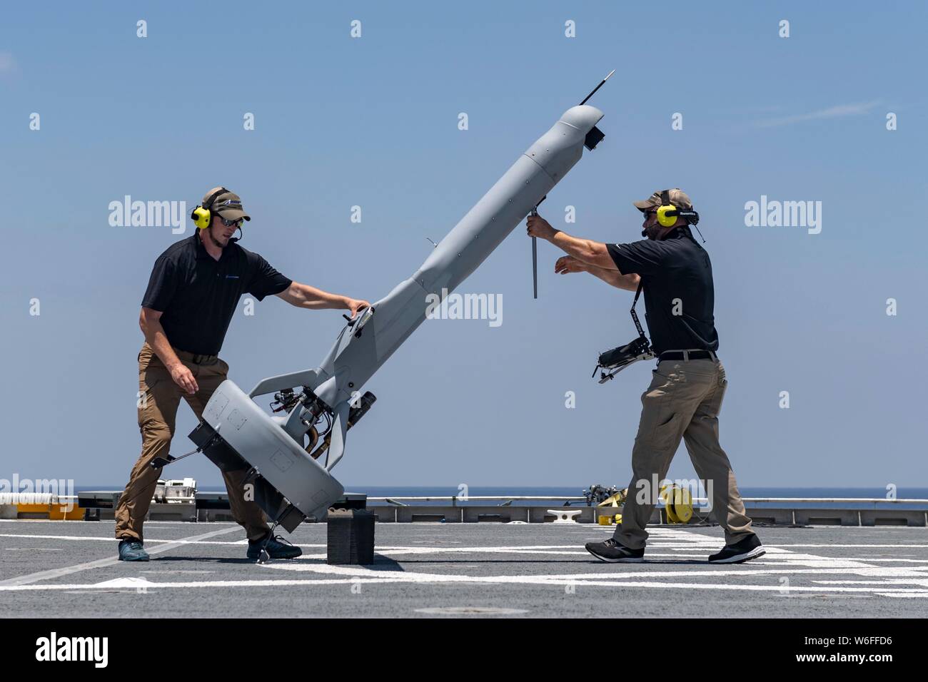 A U.S. Navy VBAT vertical take-off and landing unmanned aerial system drone prepares to launch from the flight deck of the Military Sealift Command expeditionary fast transport vessel USNS Spearhead July 24, 2019 in the Atlantic Ocean off the coast of Florida. The VBAT UAS provides improved detection and monitoring to support counter-narcotics missions in the Caribbean and Eastern Pacific. Stock Photo